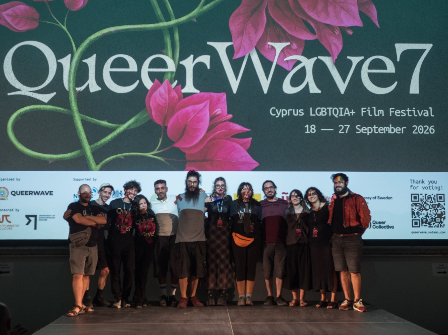 The Queer Wave team under the festival banner