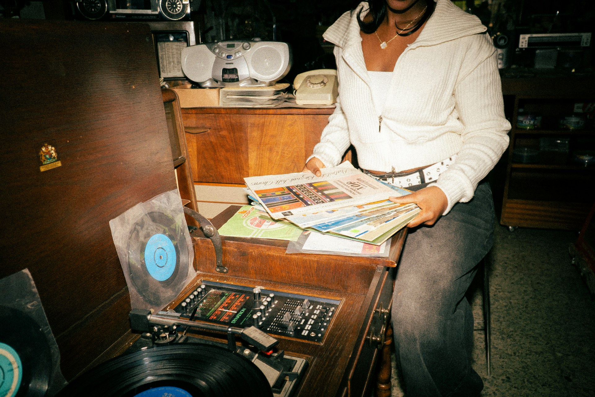 Choosing a record by a vintage record player