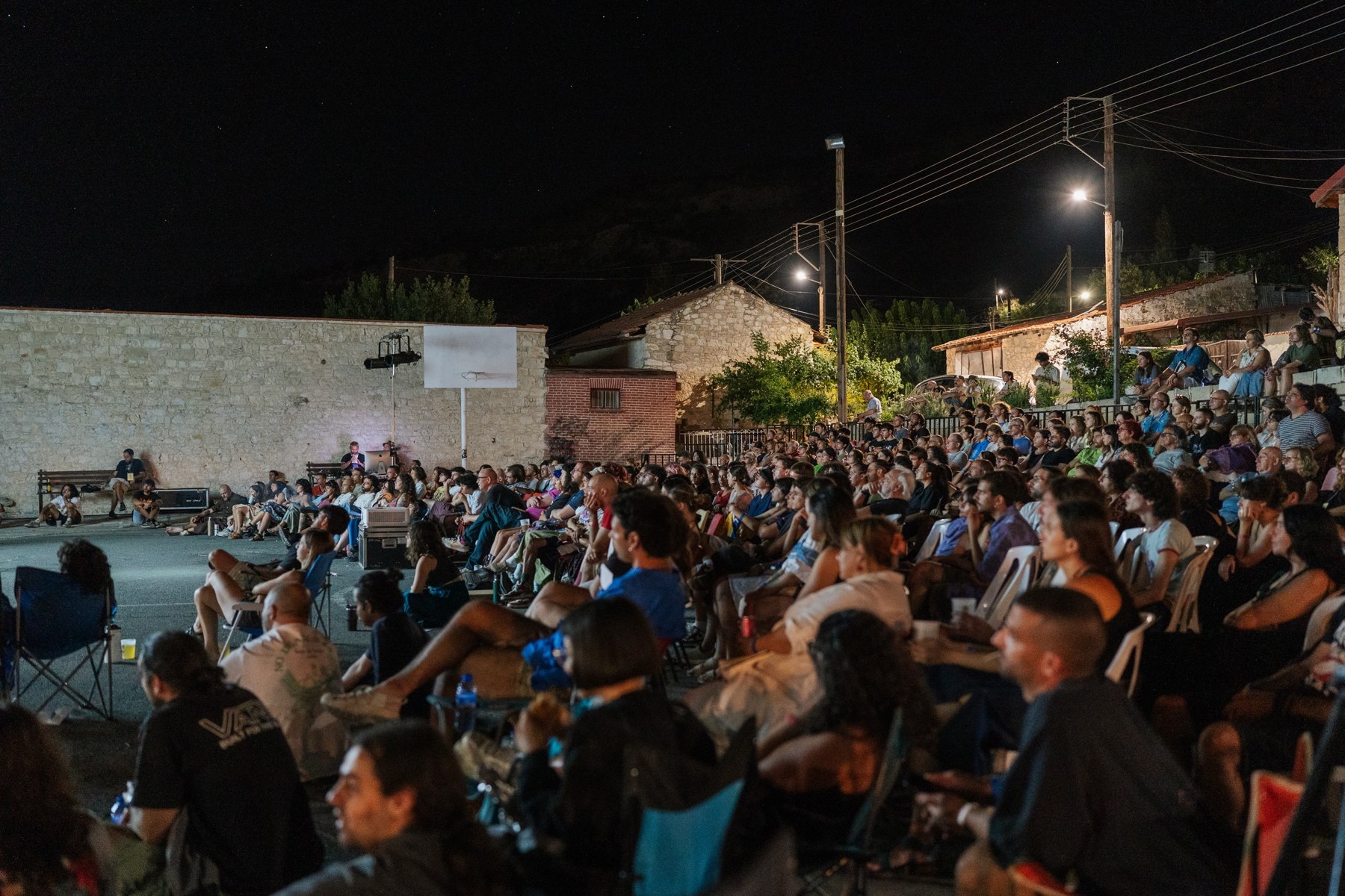 An audience gathered for an open-air screening