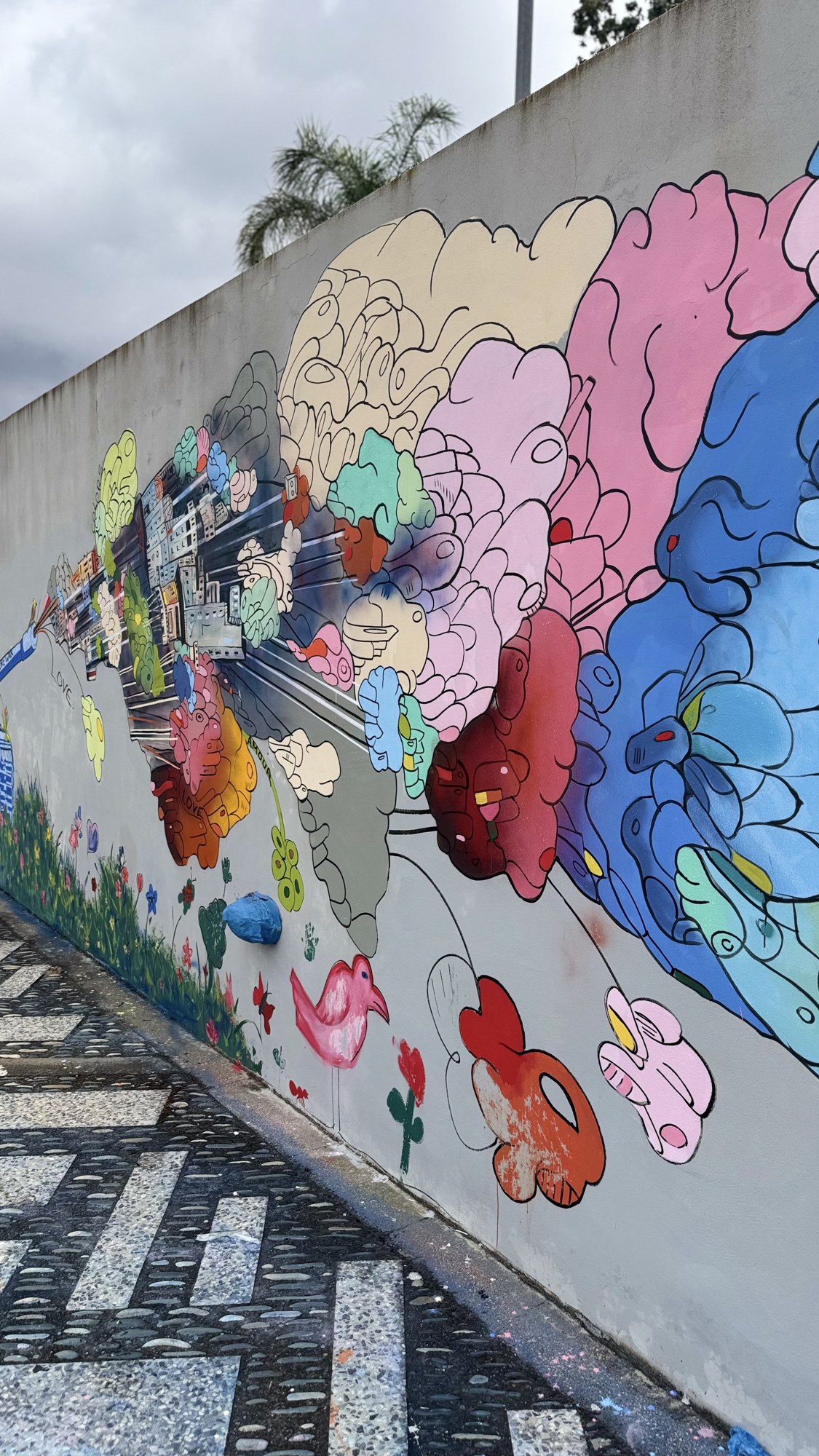 The colourful clouds of the finished mural