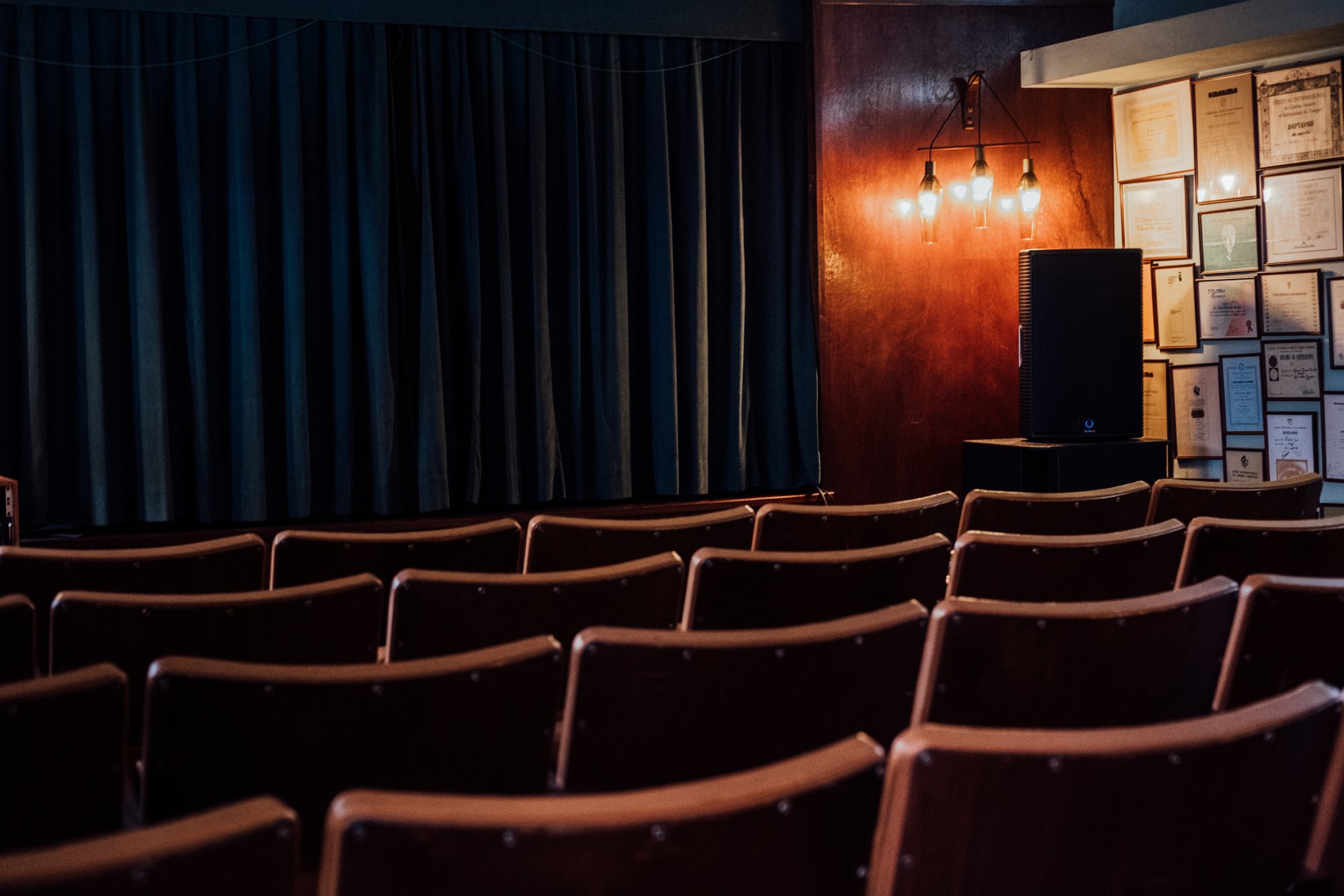 The house cinema room with rows of red seats